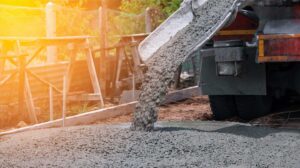 redi mix concrete truck pouring concrete on a job site